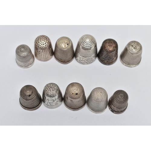 107 - AN ASSORTMENT OF SILVER AND WHITE METAL THIMBLES, comprising eight silver thimbles of various design... 