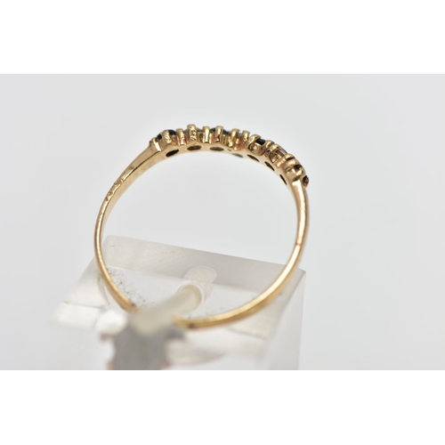 11 - A 9CT GOLD GEM SET WISH BONE RING, designed with a row of four claw set, circular cut sapphires inte... 