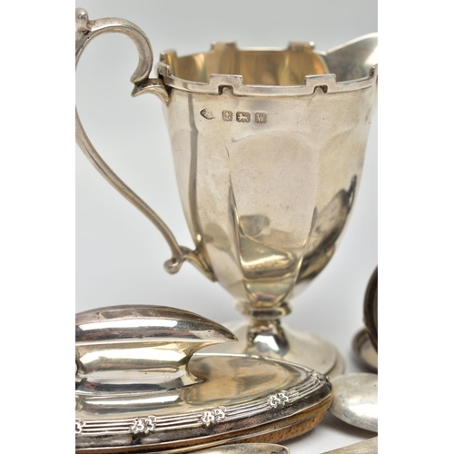 114 - AN ASSORTMENT OF SILVER ITEMS, to include a 'Georg Jensen' teaspoon with maker's mark and date for 1... 