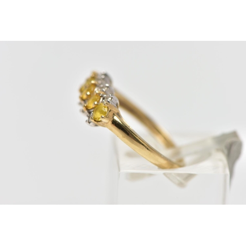 12 - A 9CT GOLD GEM SET RING, designed with a central row of five circular cut yellow stones assessed as ... 