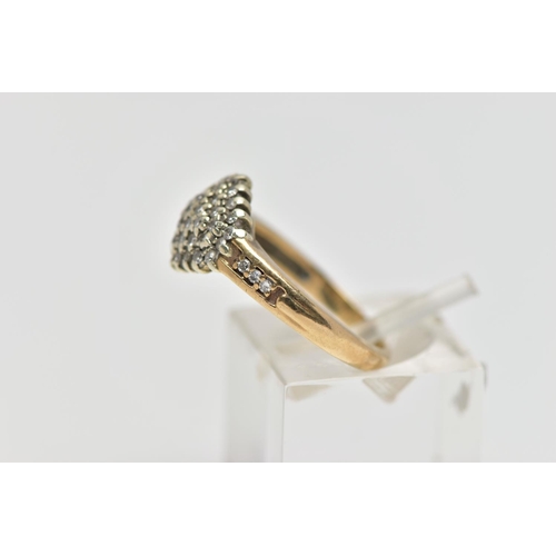 124 - A 9CT GOLD DIAMOND CLUSTER RING, of a marquise form set with single cut diamonds, single cut diamond... 