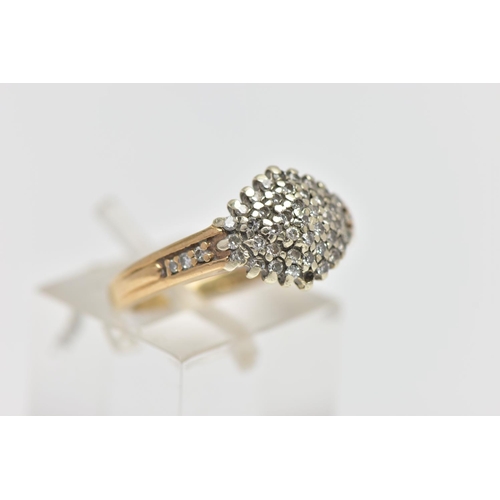 124 - A 9CT GOLD DIAMOND CLUSTER RING, of a marquise form set with single cut diamonds, single cut diamond... 