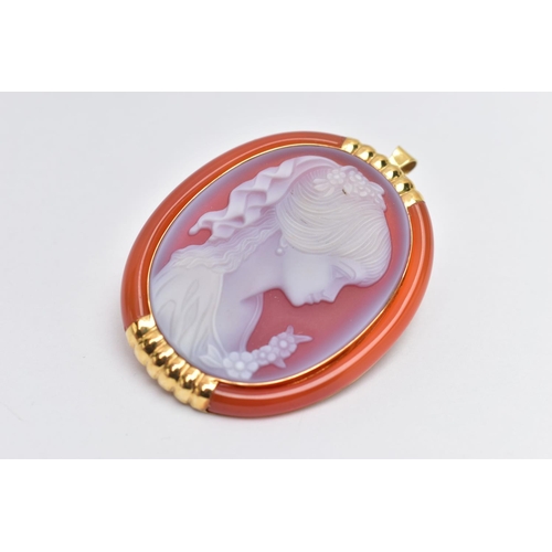 131 - A YELLOW METAL CAMEO BROOCH, of an oval form, carved sardonyx cameo depicting a lady in profile with... 