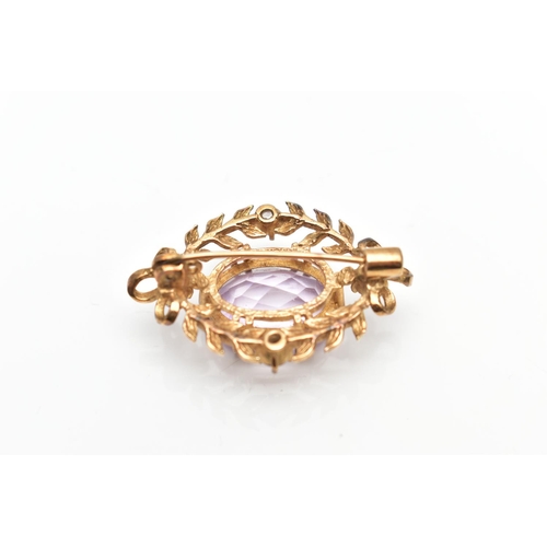 137 - A MID 20TH CENTURY 9CT GOLD AMETHYST AND CUBIC ZIRCONIA BROOCH, the oval claw set amethyst, within a... 