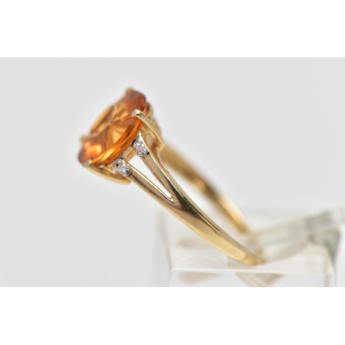 14 - A 9CT GOLD GEM SET RING, four claw set, fancy circular cut orange stone assessed as citrine, bifurca... 