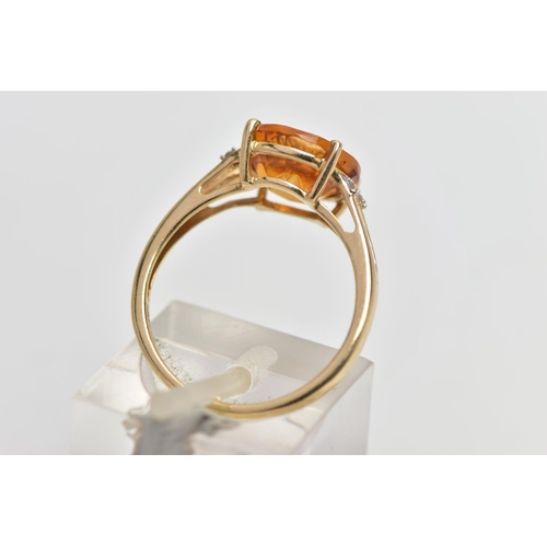 14 - A 9CT GOLD GEM SET RING, four claw set, fancy circular cut orange stone assessed as citrine, bifurca... 