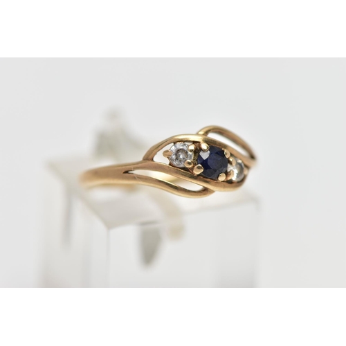 15 - A 9CT GOLD GEM SET RING, asymmetrical design, centring on a four claw set, circular cut deep blue sa... 