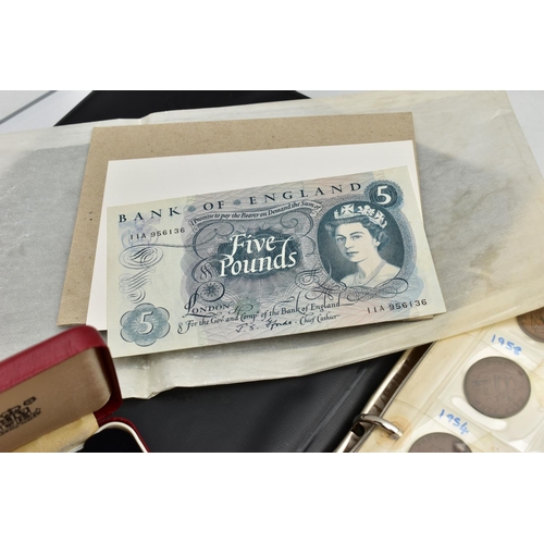 196 - A TIN AND FILE CASE OF COINS AND BANKNOTES, to include a cased set of Sir Winston Churchill commemor... 