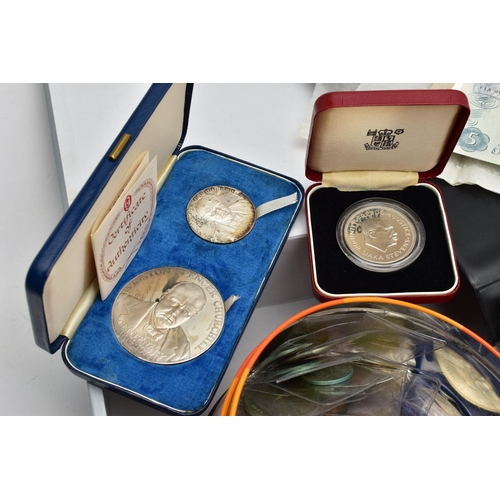 196 - A TIN AND FILE CASE OF COINS AND BANKNOTES, to include a cased set of Sir Winston Churchill commemor... 