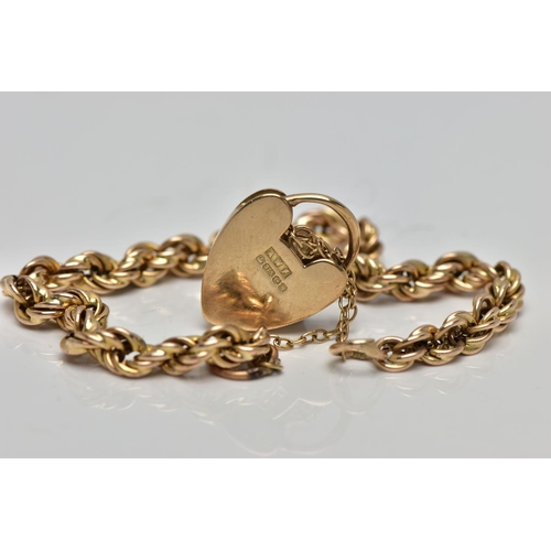 2 - A 9CT GOLD ROPE TWIST BRACELET, hollow rope twist chain, fitted with a heart padlock hallmarked 9ct ... 