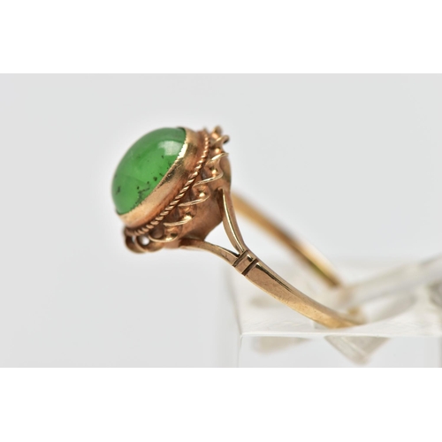 25 - A 9CT GOLD CHRYSOPRASE SINGLE STONE RING, the oval chrysoprase cabochon collet set with rope twist s... 