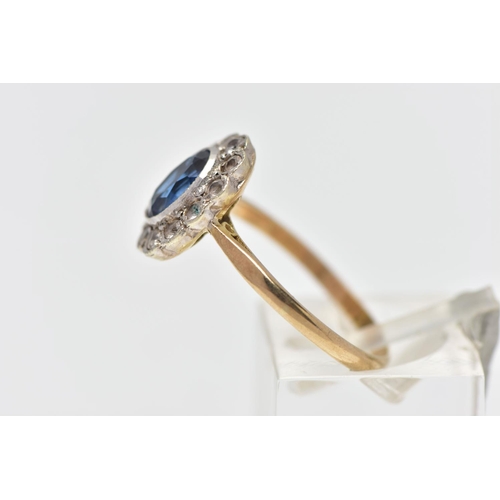 27 - A 9CT GOLD SAPPHIRE AND CUBIC ZIRCONIA CLUSTER RING, the oval cut sapphire collet set, with circular... 