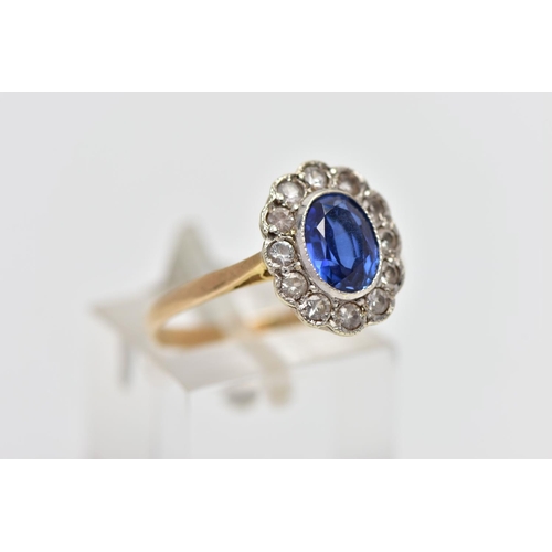 27 - A 9CT GOLD SAPPHIRE AND CUBIC ZIRCONIA CLUSTER RING, the oval cut sapphire collet set, with circular... 