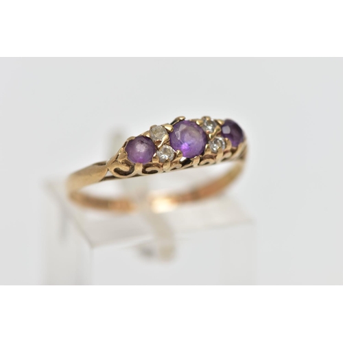 28 - A 9CT GOLD AMETHYST AND CUBIC ZIRCONIA DRESS RING, the circular cut amethyst and similarly cut cubic... 