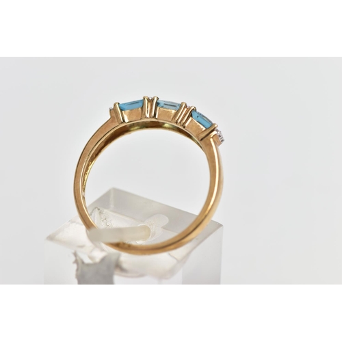 29 - A 9CT GOLD TOPAZ AND DIAMOND DRESS RING, the cushion cut blue topaz with single cut diamond duo spac... 