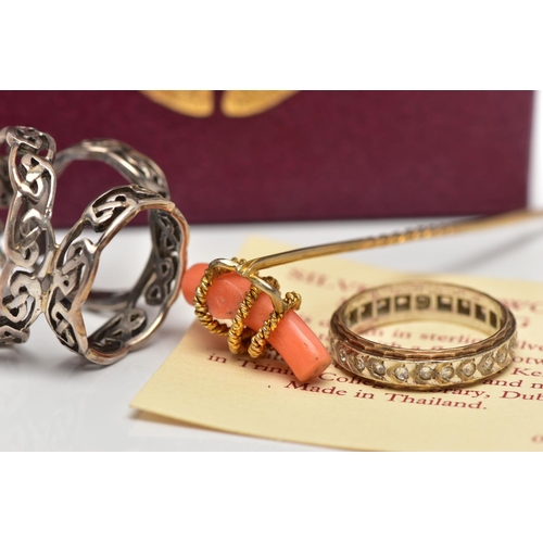 46 - A 9CT GOLD ETERNITY RING, A YELLOW METAL CORAL STICKPIN AND A SCARF RING, the first designed as a ci... 