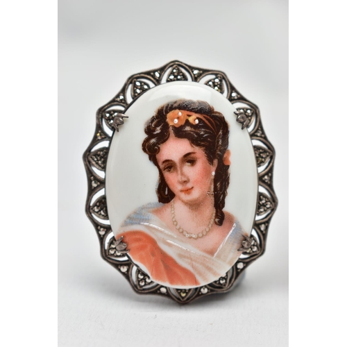 53 - AN EARLY 20TH CENTURY SILVER MINIATURE PORTRAIT AND TWO BROOCHES, to include a large oval silver por... 