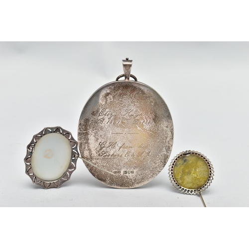 53 - AN EARLY 20TH CENTURY SILVER MINIATURE PORTRAIT AND TWO BROOCHES, to include a large oval silver por... 