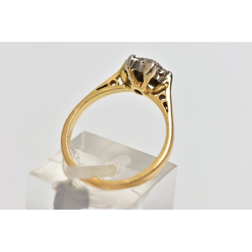 56 - A YELLOW AND WHITE METAL CLUSTER RING, a circular cut sapphire and six single cut diamonds prong set... 