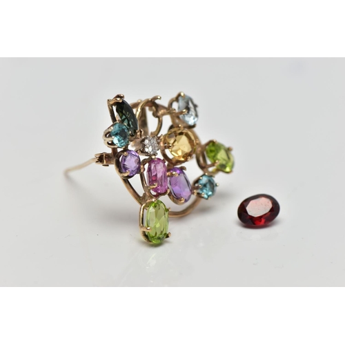 62 - A 9CT GOLD DIAMOND AND COLOURED GEM SET BROOCH, of openwork design the circular cut diamond, estimat... 