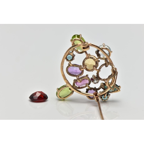 62 - A 9CT GOLD DIAMOND AND COLOURED GEM SET BROOCH, of openwork design the circular cut diamond, estimat... 