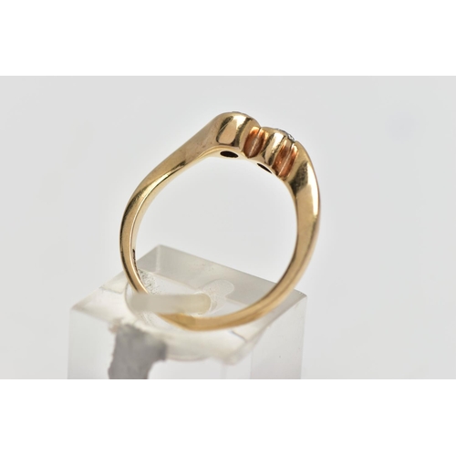 63 - A 9CT YELLOW GOLD DIAMOND TWO STONE CROSSOVER RING, set with two round brilliant cut diamonds, each ... 