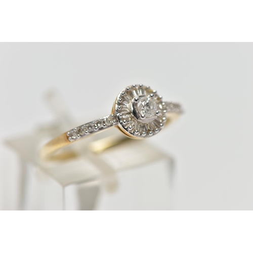 64 - A 9CT YELLOW AND WHITE GOLD DIAMOND CLUSTER RING, set with a principal round brilliant cut diamond, ... 