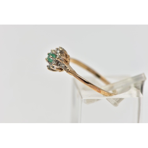 66 - A 9CT GOLD EMERALD AND DIAMOND CLUSTER RING, set with a circular cut emerald, within a round brillia... 