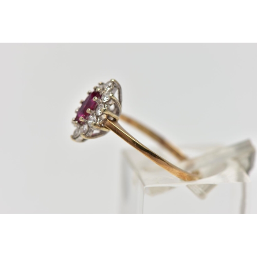 69 - A 9CT YELLOW AND WHITE GOLD RUBY AND DIAMOND CLUSTER RING, set with a marquise shape ruby, within a ... 