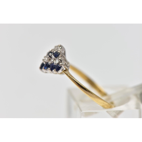 70 - AN 18CT YELLOW AND WHITE GOLD SAPPHIRE AND DIAMOND DRESS RING, the marquise shape tiered cluster set... 