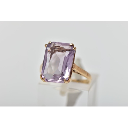 77 - A 9CT GOLD AMETHYST SINGLE STONE RING, the rectangular shape amethyst measuring approximately 14mm x... 