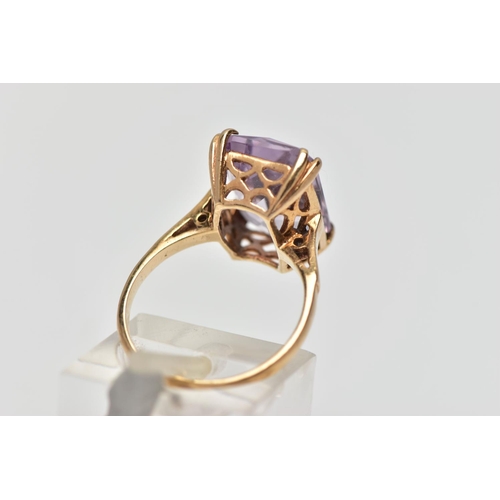 77 - A 9CT GOLD AMETHYST SINGLE STONE RING, the rectangular shape amethyst measuring approximately 14mm x... 