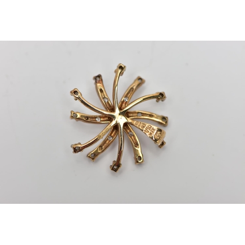 78 - A 9CT GOLD DIAMOND SWIRL PENDANT, of scrolling design, the single cut diamond spray, with similarly ... 