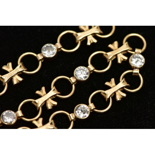 8 - A YELLOW METAL CUBIC ZIRCONIA LINE BRACELET, designed with six collet set, circular cut colourless c... 