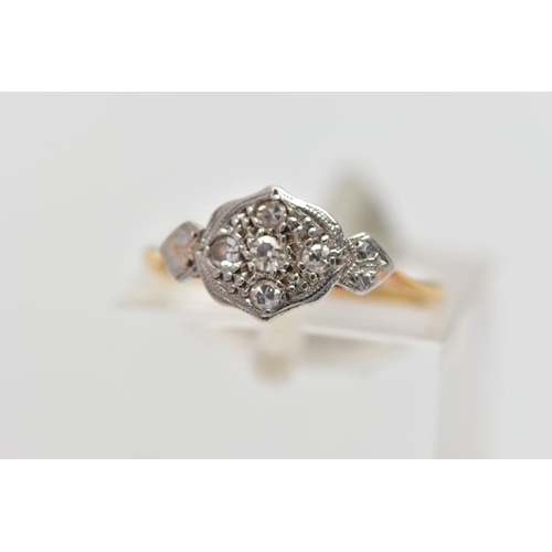 80 - A YELLOW METAL DIAMOND DRESS RING, designed as a series of single cut diamonds set within a foliate ... 