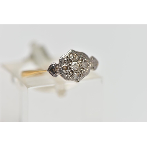 80 - A YELLOW METAL DIAMOND DRESS RING, designed as a series of single cut diamonds set within a foliate ... 