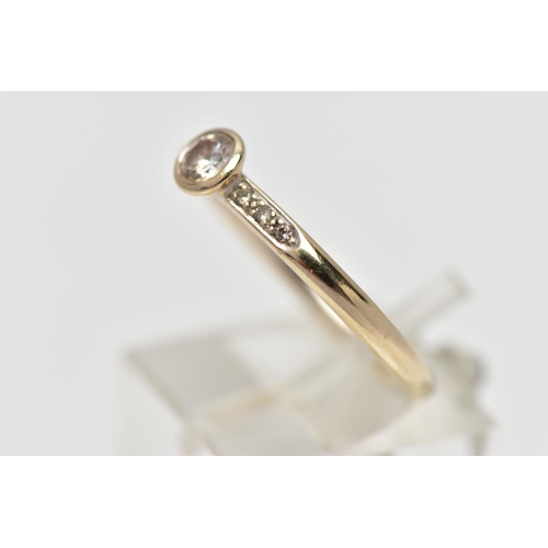 82 - AN 18CT GOLD DIAMOND DRESS RING, the brilliant cut diamond within a collet setting, to the similarly... 