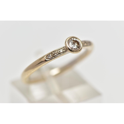 82 - AN 18CT GOLD DIAMOND DRESS RING, the brilliant cut diamond within a collet setting, to the similarly... 