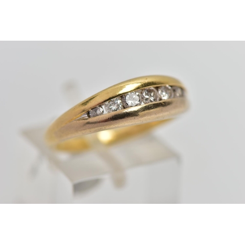 83 - AN 18CT GOLD SEVEN STONE DIAMOND RING, designed as a graduated series of brilliant cut diamonds with... 