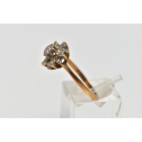 85 - AN 18CT GOLD DIAMOND FLORAL CLUSTER RING, the central brilliant cut diamond, claw set, to the single... 