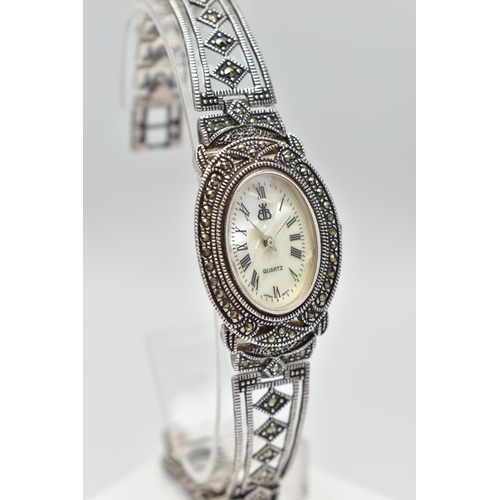 97 - A LADIES SILVER WRISTWATCH, the oval mother of pearl dial, with Roman numeral markers, dial with log... 