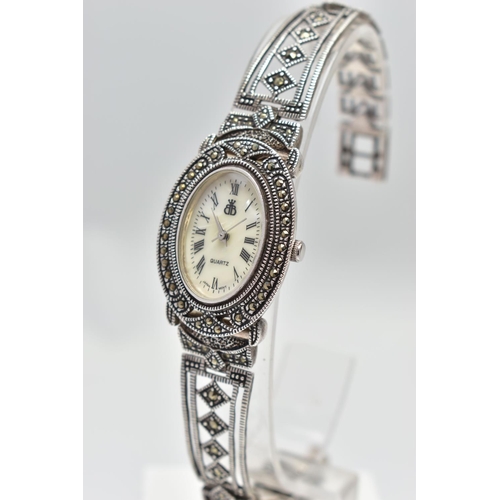 97 - A LADIES SILVER WRISTWATCH, the oval mother of pearl dial, with Roman numeral markers, dial with log... 