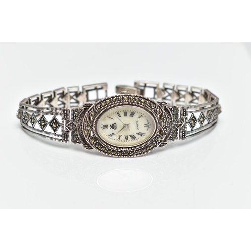 97 - A LADIES SILVER WRISTWATCH, the oval mother of pearl dial, with Roman numeral markers, dial with log... 