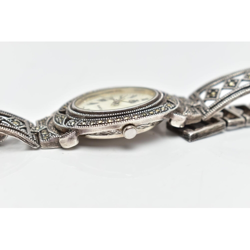 97 - A LADIES SILVER WRISTWATCH, the oval mother of pearl dial, with Roman numeral markers, dial with log... 