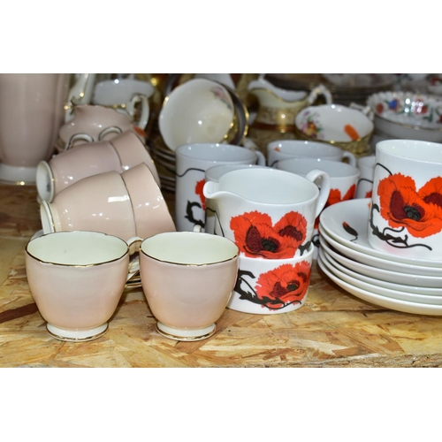 304 - THREE SETS OF CHINA TEAWARES, comprising a Bishop & Stonier 1930s red and gold floral tea set 'R101'... 