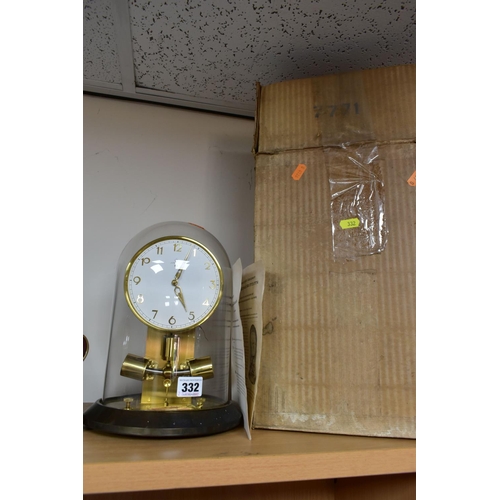 332 - A BOXED JUNGHANS ATO 1000 DAY CLOCK AND A SWIZA MIGNON MUSICAL ALARM CLOCK, the Junghans clock under... 