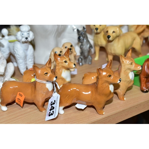 343 - A GROUP OF SIXTEEN ASSORTED BESWICK DOG FIGURES AND A ROYAL DOULTON TERRIER, including two pipe tray... 