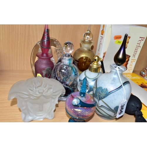 366 - A COLLECTION OF DECORATIVE GLASS PERFUME BOTTLES, REFERENCE BOOKS AND TWO PAPERWEIGHTS, including an... 