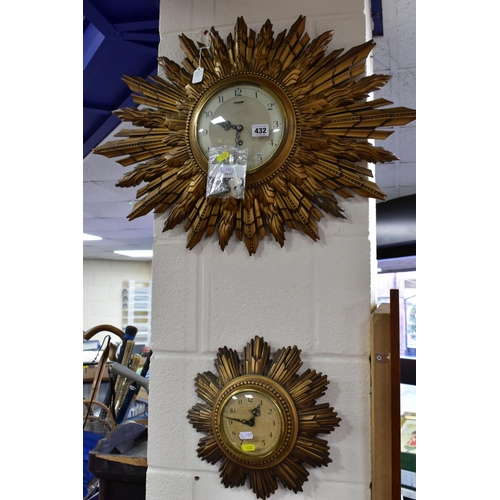 432 - TWO SMITHS SUNBURST WALL CLOCKS, comprising one with double sunburst and silvered dial, key included... 