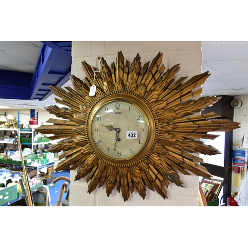 432 - TWO SMITHS SUNBURST WALL CLOCKS, comprising one with double sunburst and silvered dial, key included... 